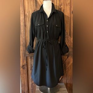 Solid black dress. It is the wicking material. It is still dressy.